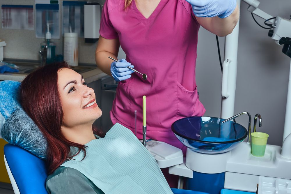 a lady is smiling before getting root canal treatment