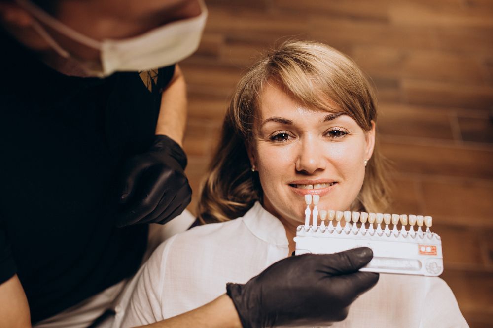 dentist is checking suitable dental crown for a lady before treatment