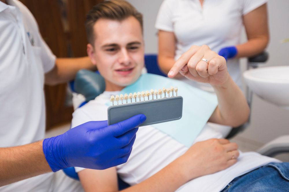 a man is visiting a dentist for composite filling treatment