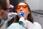 lady is getting composite filling treatment
