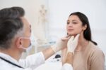 dentist is checking a patient