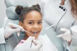 a kid is getting dental treatment