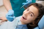 a lady is smiling after getting endodontic treatment